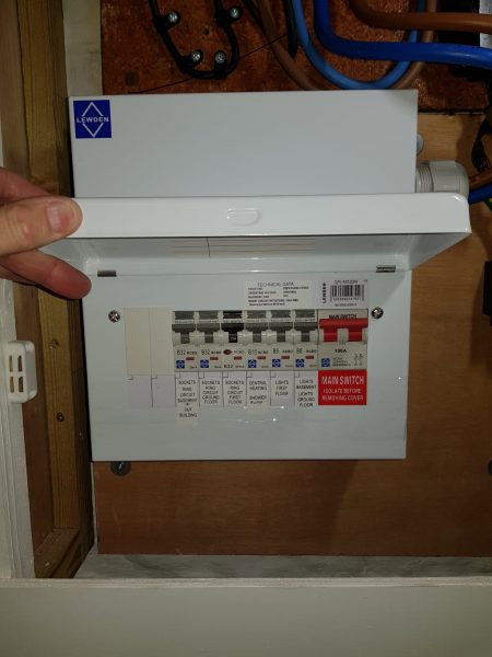 House B, Image 3. New Fuse Board Installed. Cover open to show the neatly labelled switches. 