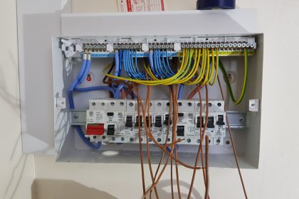 Image 1 of 2: New fuse board in position and dressed for wiring