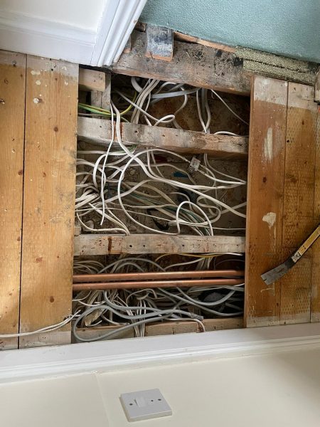 Circuit cables feeding fuse board. These look like tangled spaghetti. 